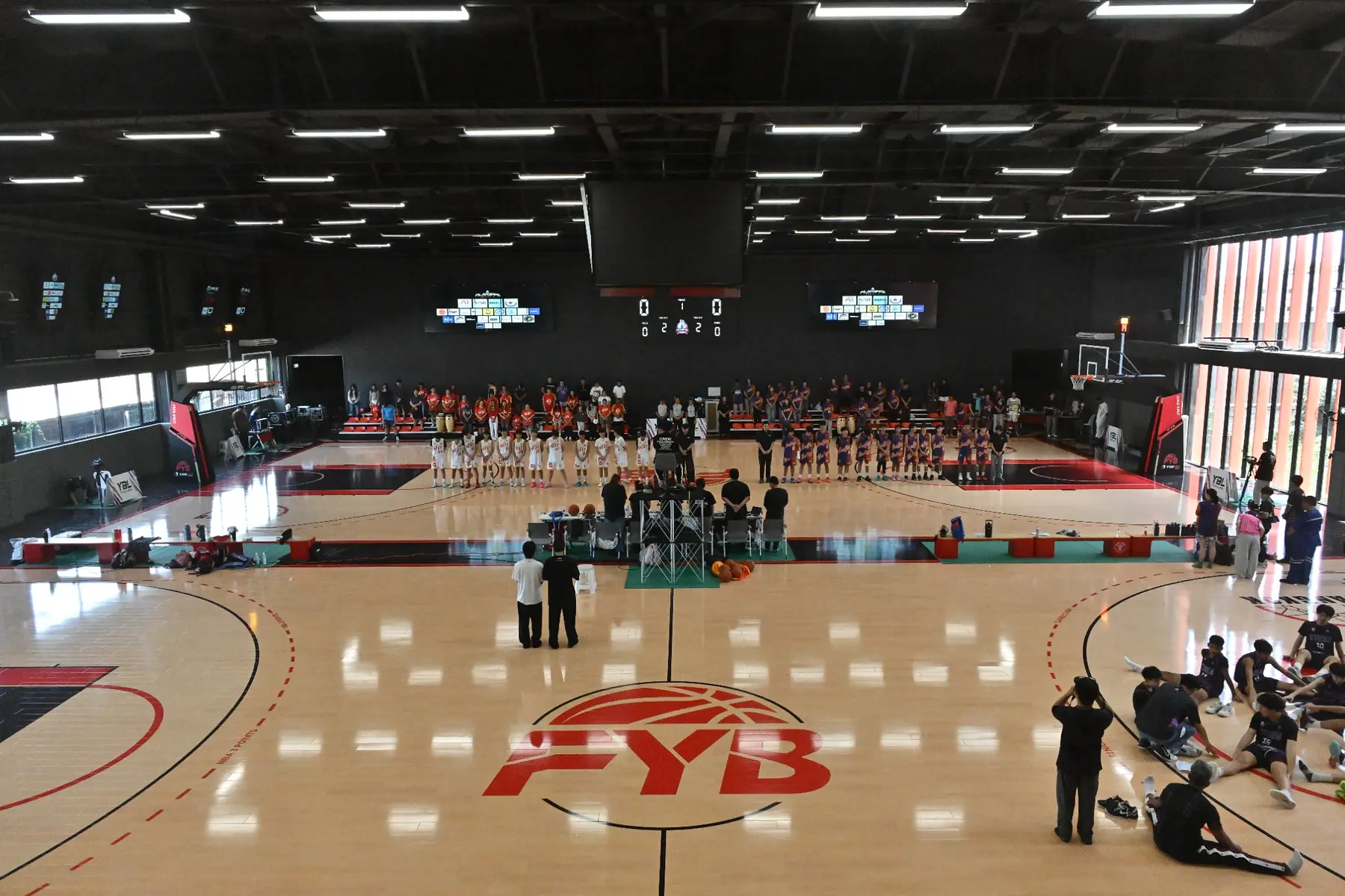Wide view of FYB's two indoor basketball courts during a youth tournament at THE O2 Bangkok